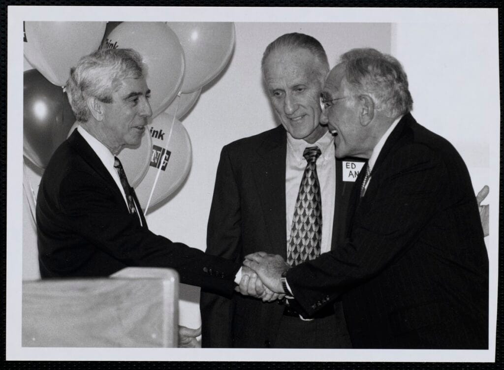 Ed Ansin (center) and his brother Ron Ansin (right)