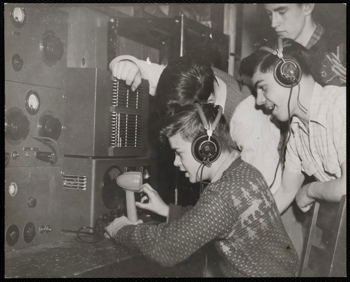 Boys learning how to use a ham radio at the Charlestown Boys Club