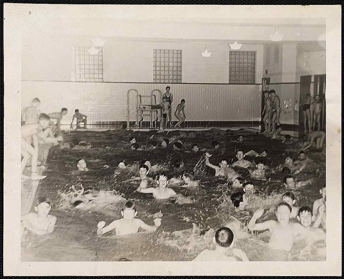 Boys swimming in a pool at a Boston Boys Club
